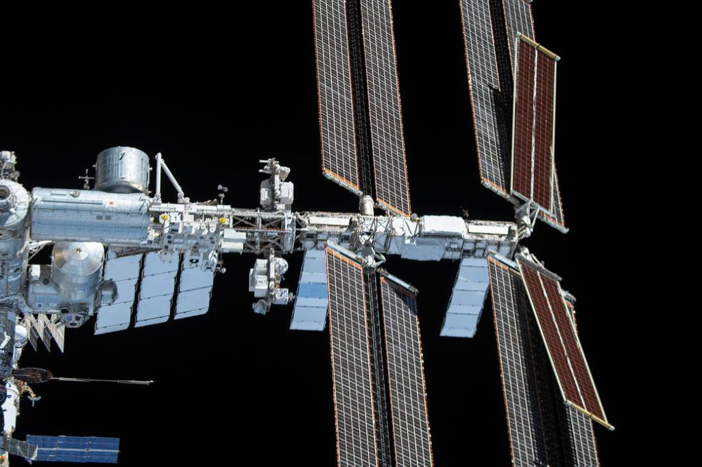 The space station is pictured from the SpaceX Crew Dragon