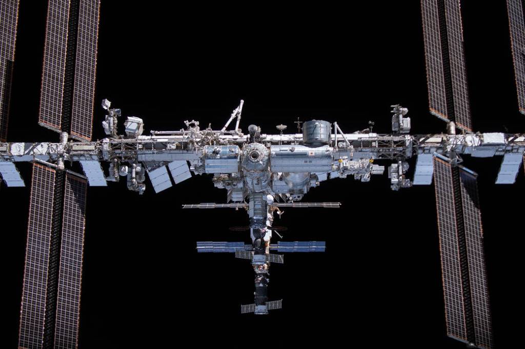 The space station is pictured from the SpaceX Crew Dragon