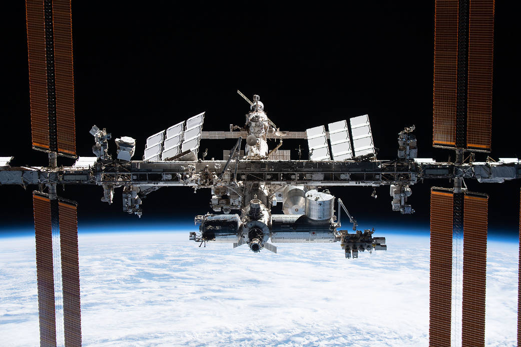 The space station is pictured from the SpaceX Crew Dragon