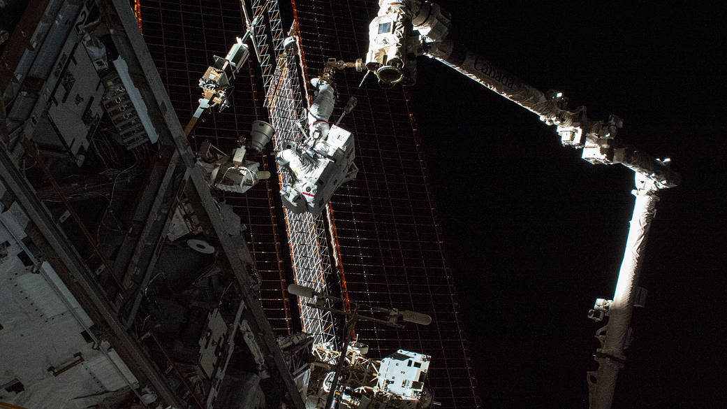 NASA spacewalker Thomas Marshburn rides the Canadarm2 robotic arm