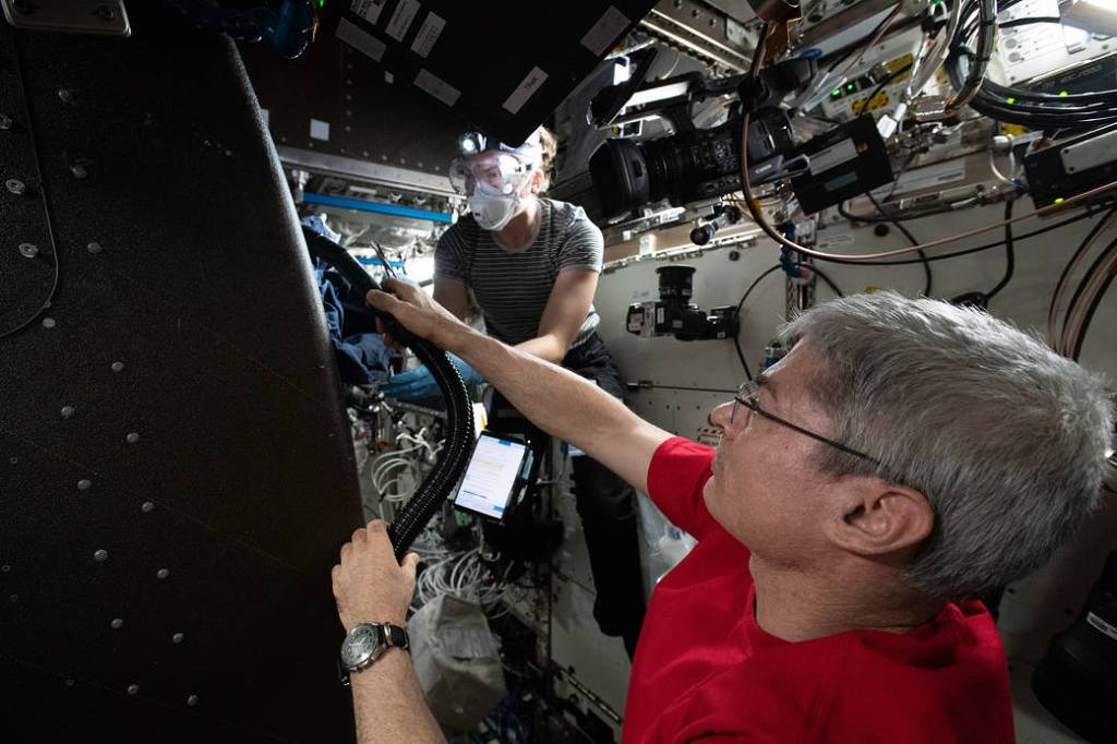 Astronauts Mark Vande Hei and Kayla Barron inspect cables