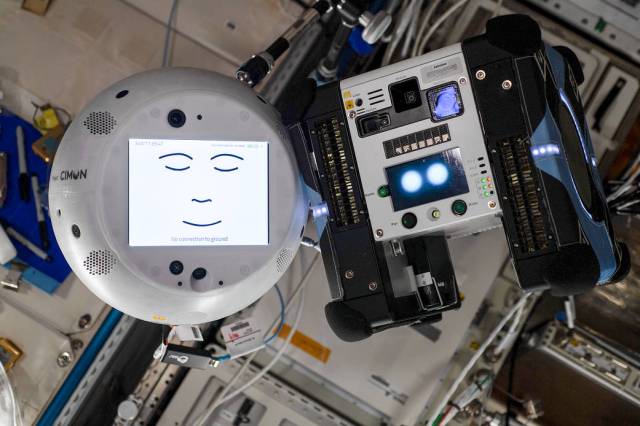 The Astrobee and Project CIMON (Crew Interactive MObile companioN) robots side by side aboard the International Space Station. 