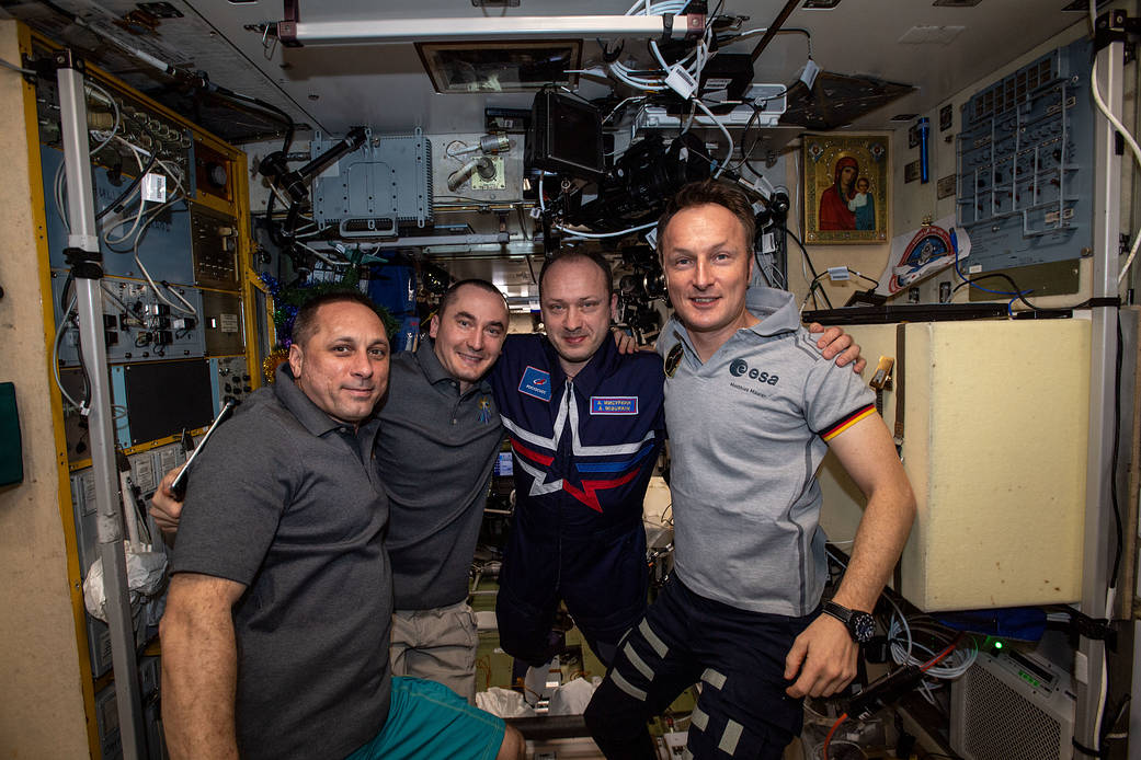 Expedition 66 crew members in the station's Russian segment