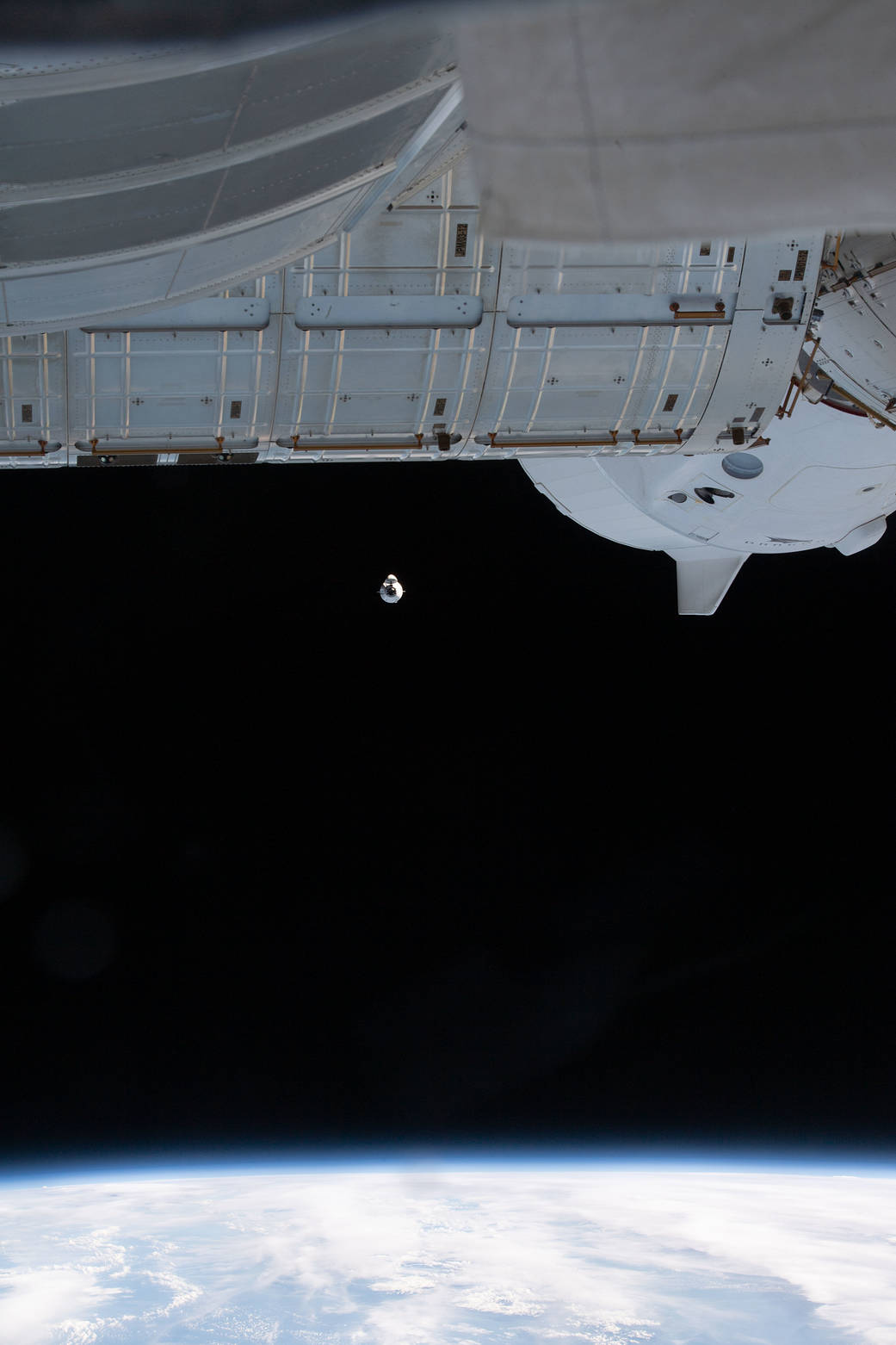 The SpaceX Cargo Dragon approaches the station on Dec. 22. The SpaceX Crew Dragon Endeavour can be seen docked to the Harmony module's forward port.