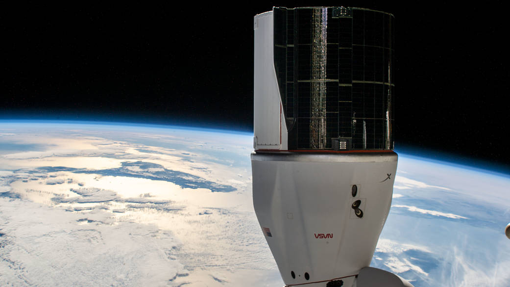 The SpaceX Cargo Dragon is pictured docked to the space station