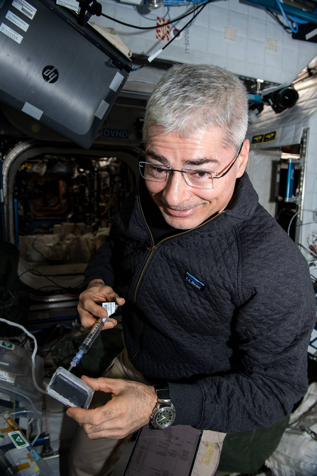 Astronaut Mark Vande Hei works on the MVP-Plant-01 space botany study