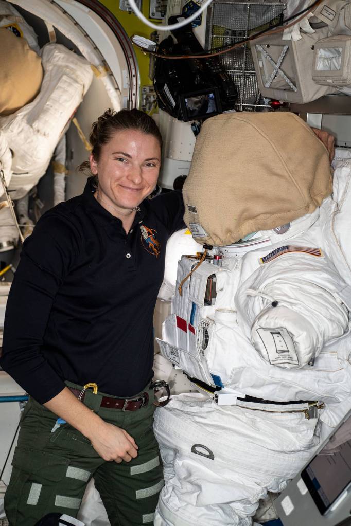 Astronaut Kayla Barron works on a U.S. spacesuit