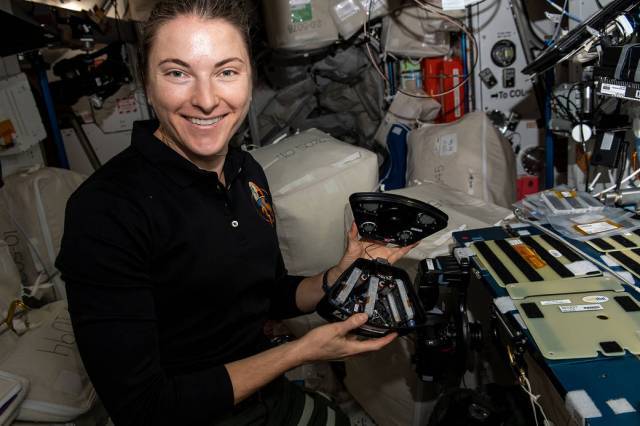 Astronaut Kayla Barron works on a space botany experiment