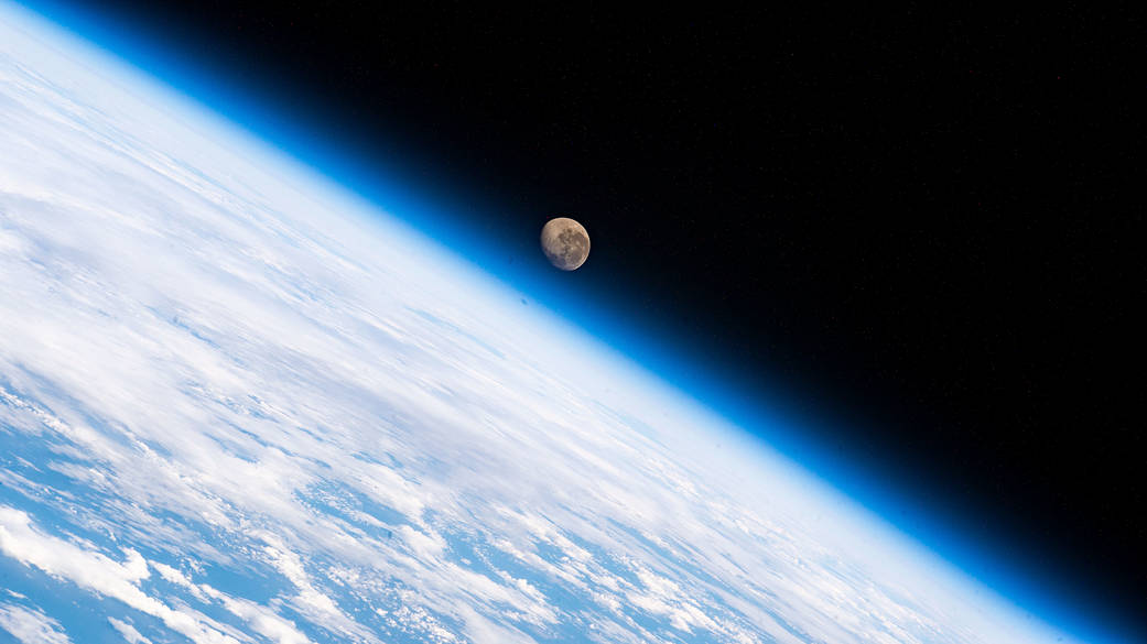 The waning gibbous Moon above the Earth's horizon