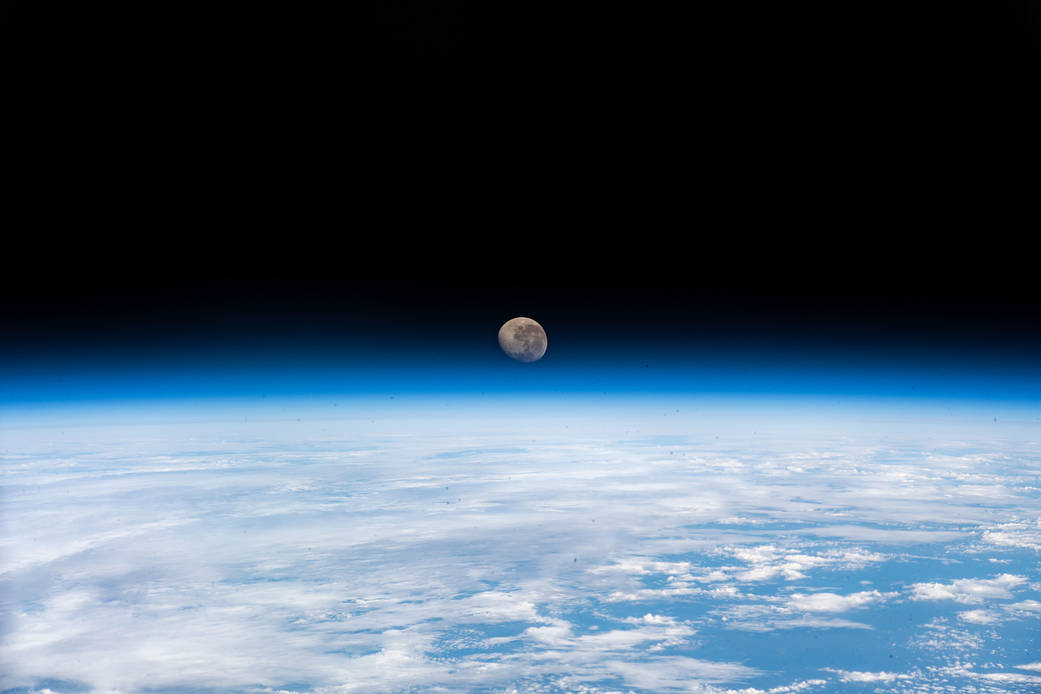 The waning gibbous Moon above the Earth's horizon