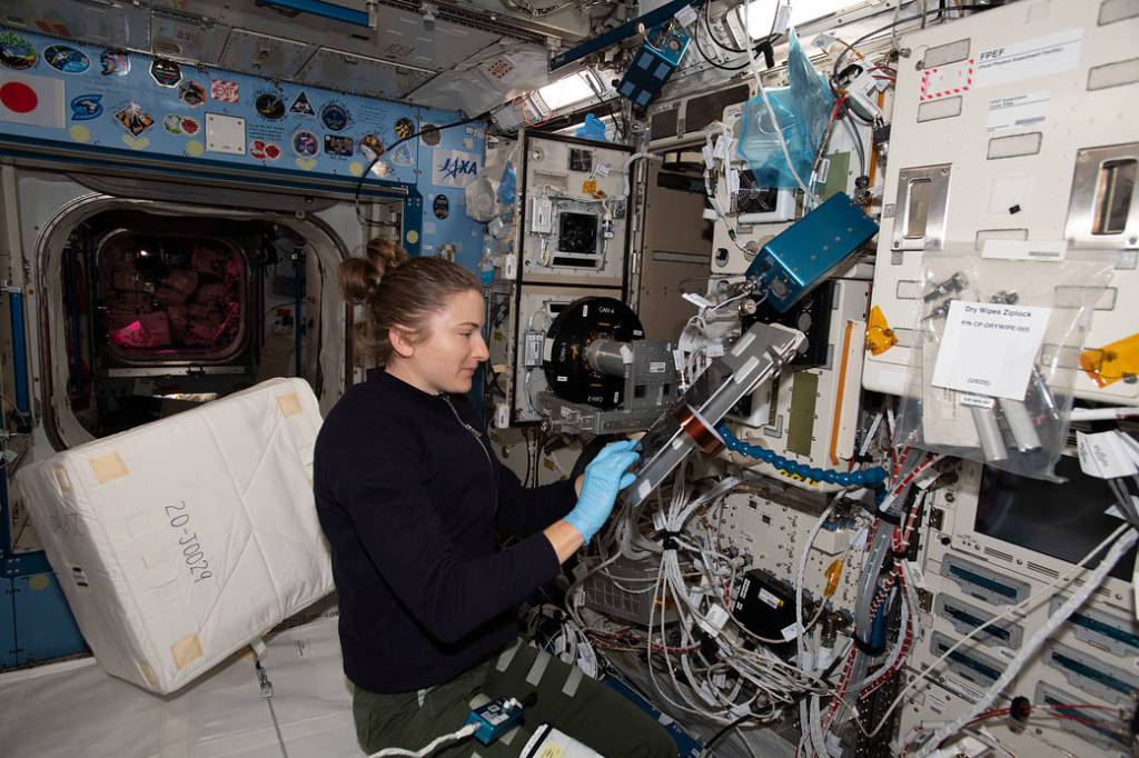 Astronaut Kayla Barron cleans the Cell Biology Experiment Facility