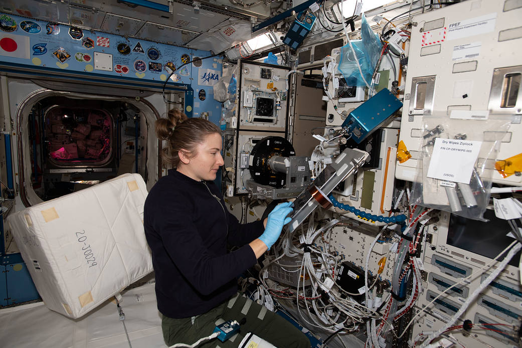 Astronaut Kayla Barron cleans the Cell Biology Experiment Facility