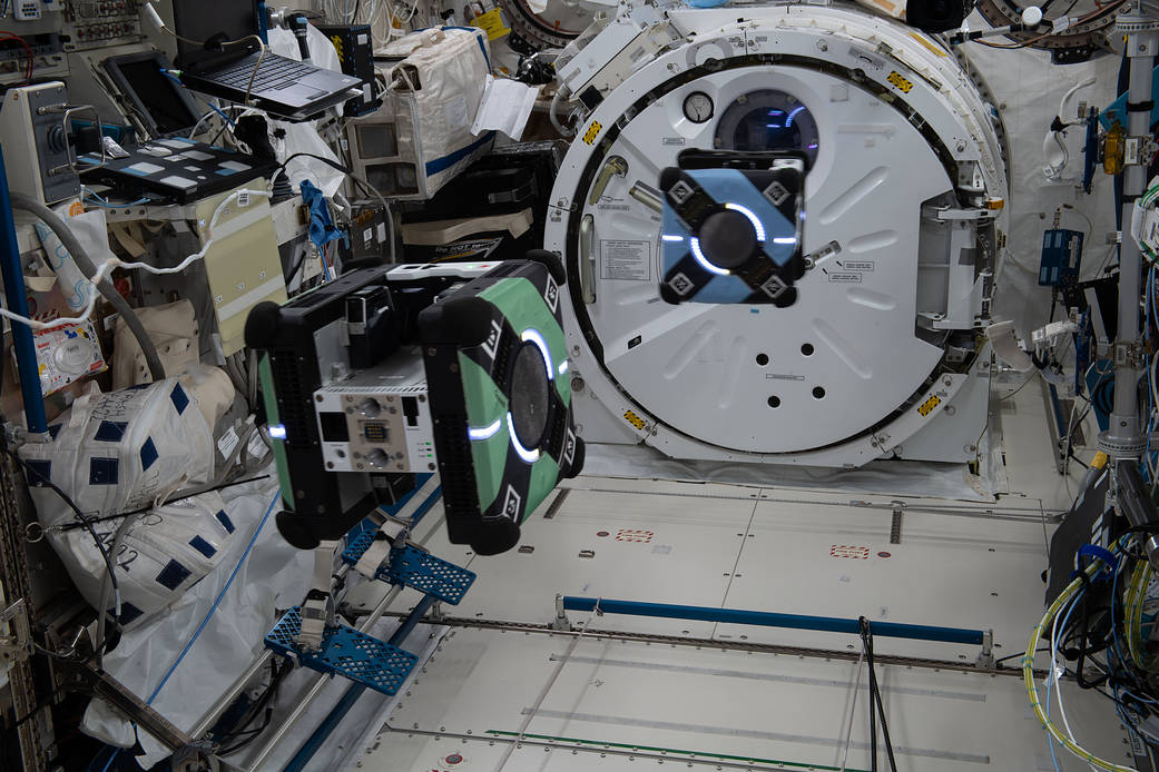 A pair of free-flying Astrobee robotic assistants