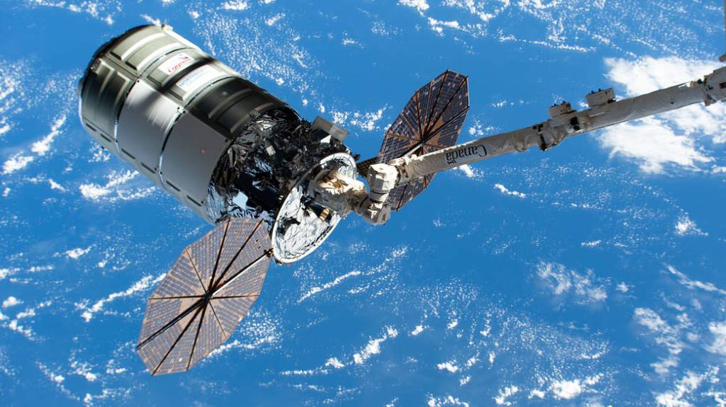 Cygnus in the grip of the Canadarm2 robotic arm