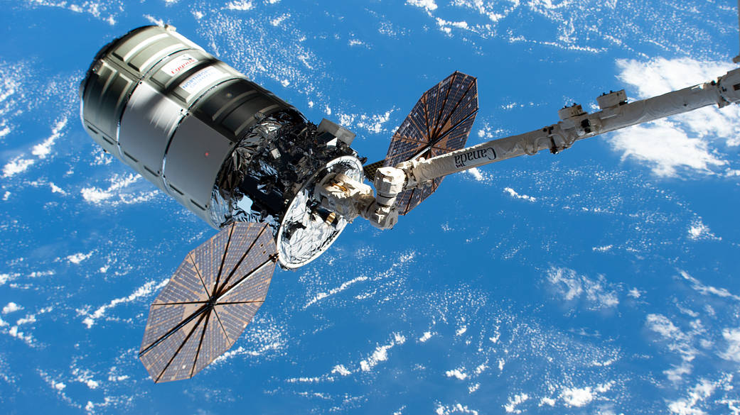 Cygnus in the grip of the Canadarm2 robotic arm