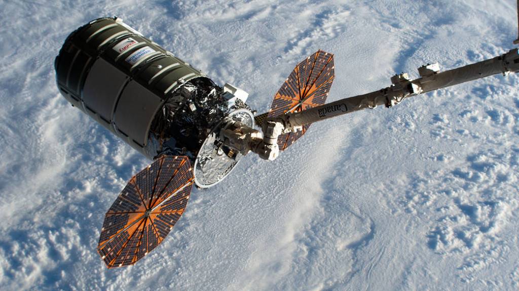 Cygnus in the grip of the Canadarm2 robotic arm