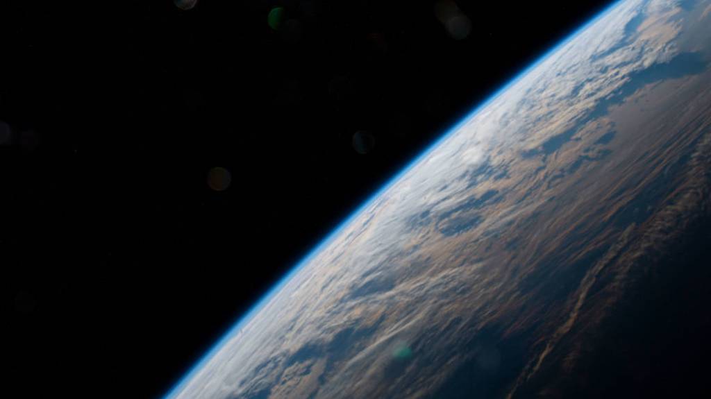The Earth is illuminated shortly after an orbital sunrise