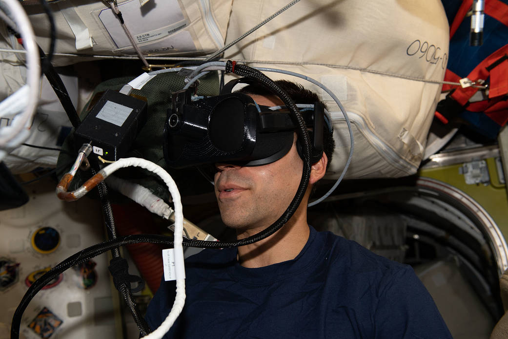 Astronaut Raja Chari wears virtual reality goggles