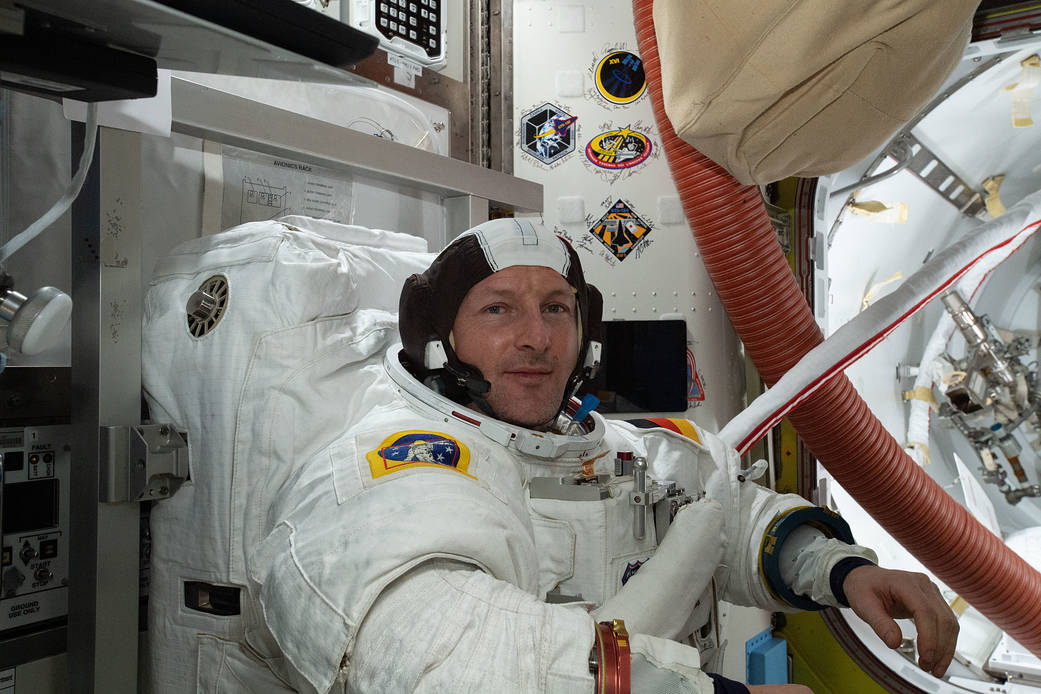ESA astronaut Matthias Maurer conducts a fit check of his U.S. spacesuit
