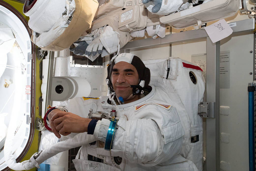 NASA astronaut Raja Chari conducts a fit check of his U.S. spacesuit