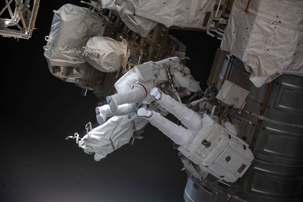 Astronauts Kayla Barron and Raja Chari exit the U.S. Quest airlock