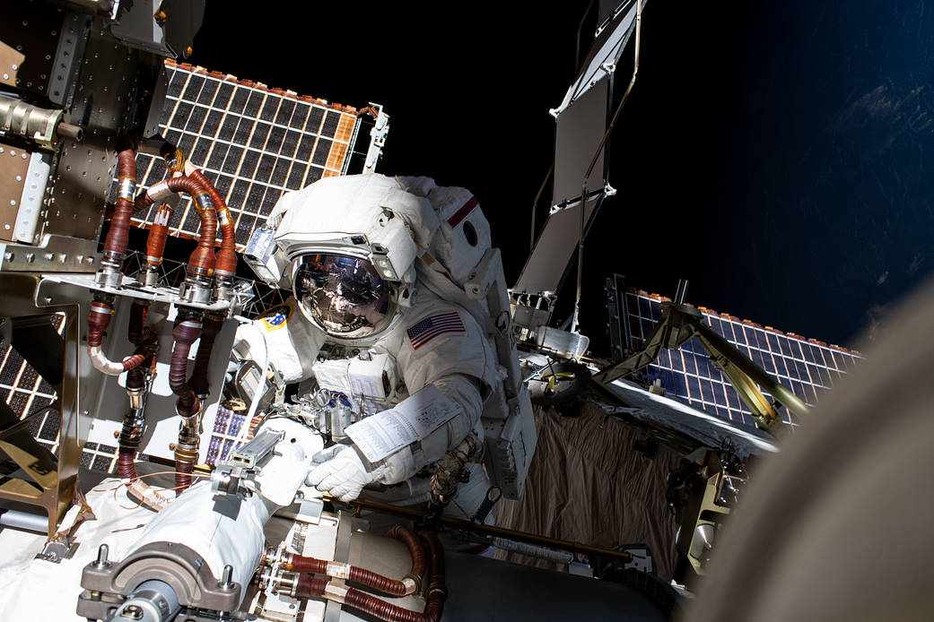 NASA spacewalker Kayla Barron installs a solar array modification kit
