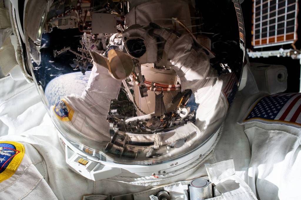 NASA spacewalker Kayla Barron takes a “space-selfie”