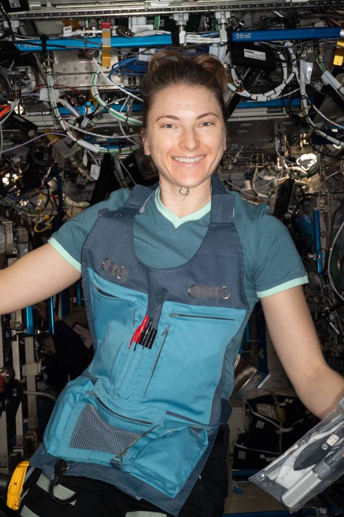 Astronaut Kayla Barron poses for a portrait during maintenance work
