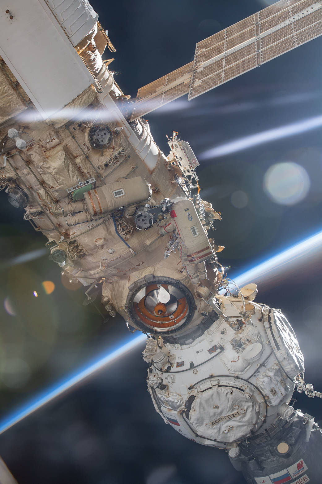 Cosmonauts Oleg Artemyev and Denis Matveev during a spacewalk