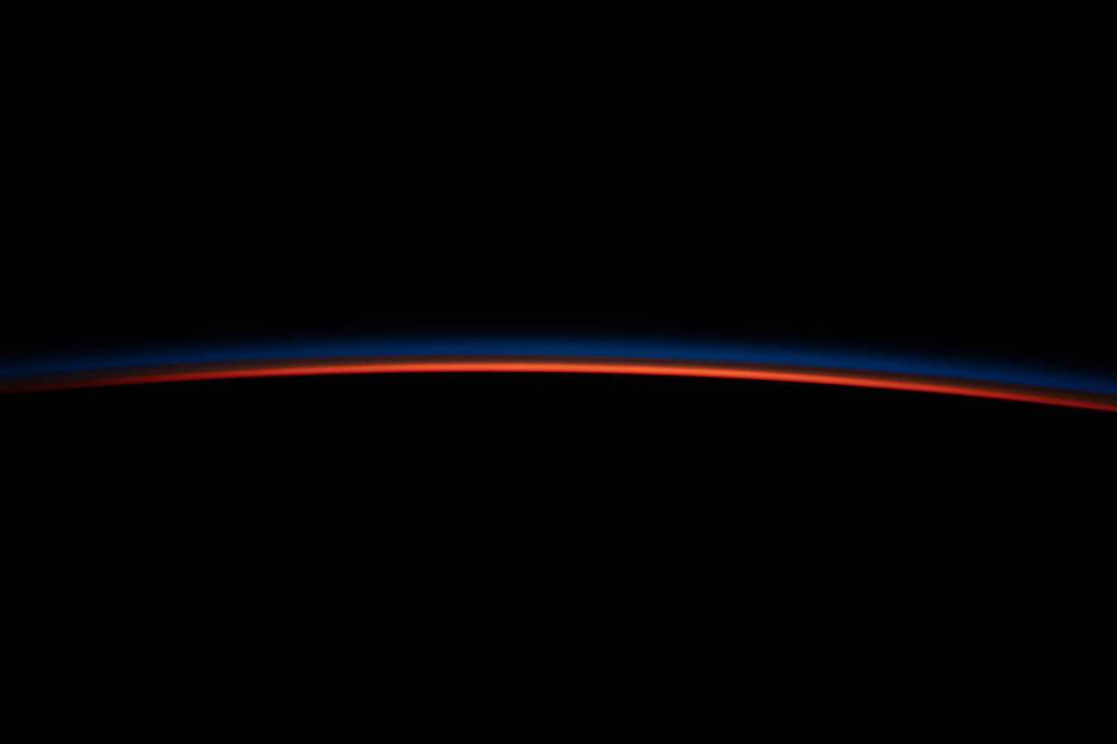 The last rays of an orbital sunset illuminate Earth’s horizon