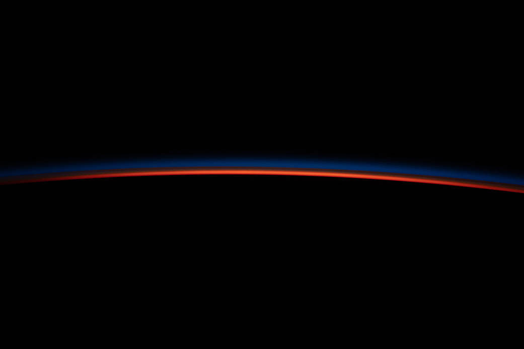 The last rays of an orbital sunset illuminate Earth's horizon