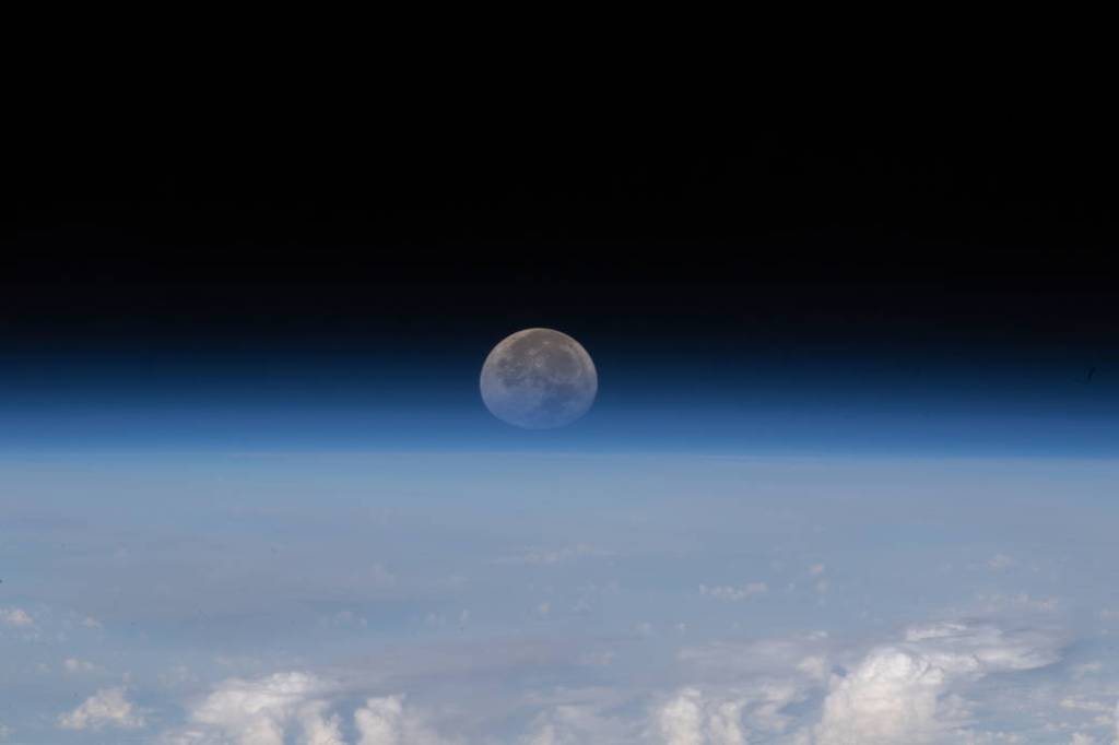 The Moon sets below Earth’s horizon