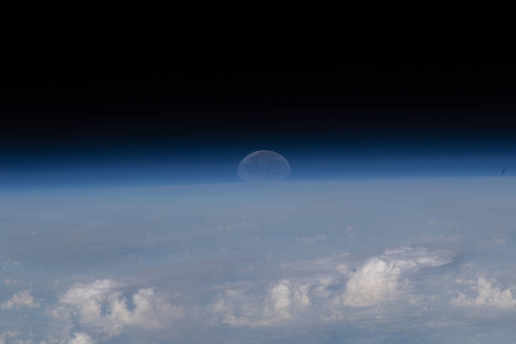 The Moon sets below Earth's horizon