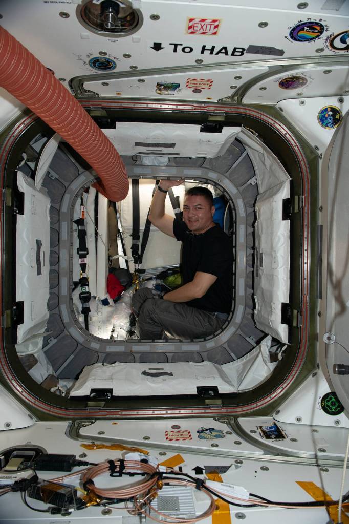 Astronaut Kjell Lindgren is pictured in the vestibule between Unity and Cygnus