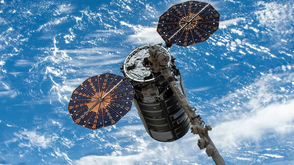 Cygnus space freighter in the grips of the Canadarm2 robotic arm