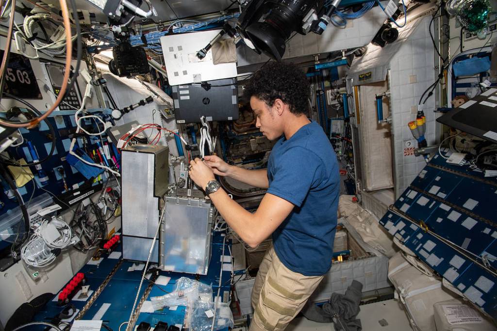 Astronaut Jessica Watkins works on electrical system components