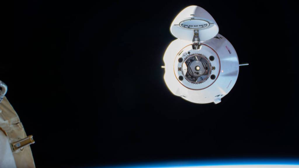 The SpaceX Dragon resupply ship approaches the space station