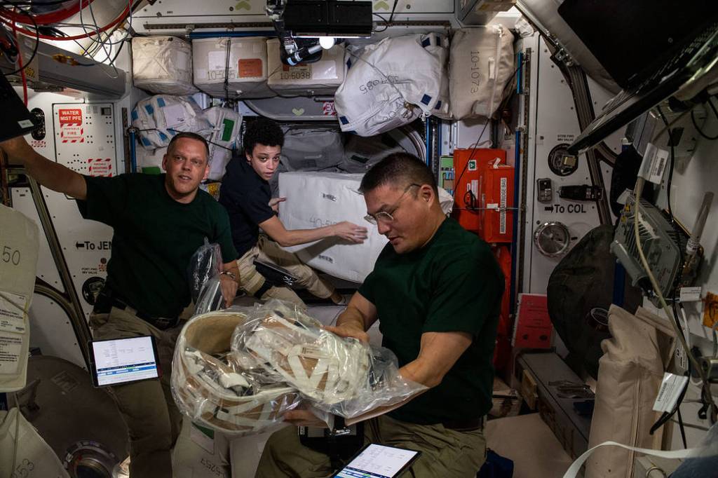 NASA astronauts unload the SpaceX Dragon resupply ship