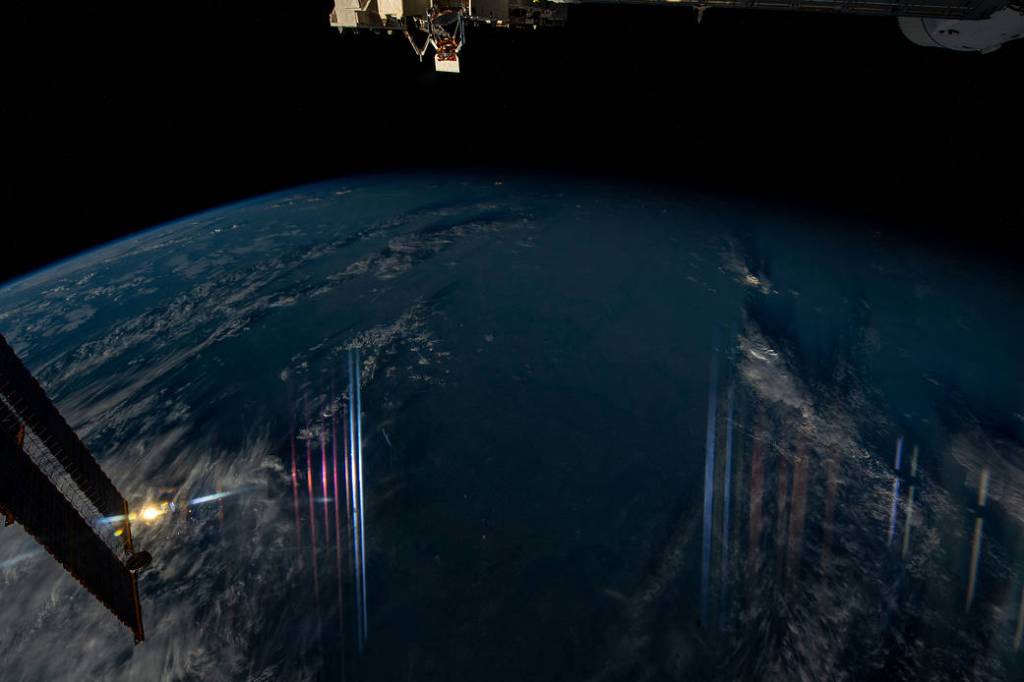 Instrumentation lights reflect off a window above eastern Europe