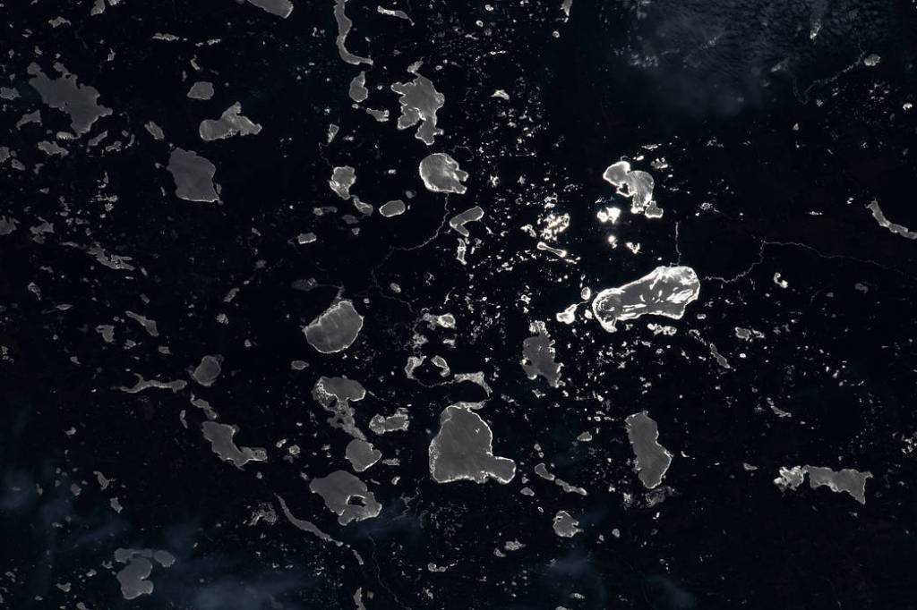 The Moon’s glint beams off lakes on the U.S.-Canadian border