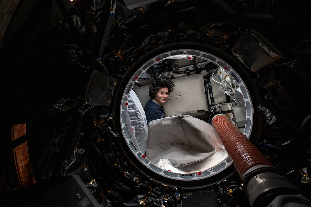 Astronaut Samantha Cristoforetti packs cargo inside the SpaceX Dragon