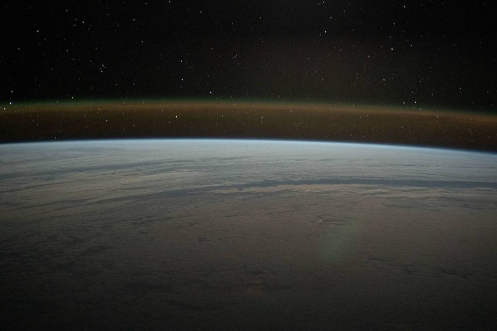 A cloud-covered Atlantic Ocean beneath a starry sky