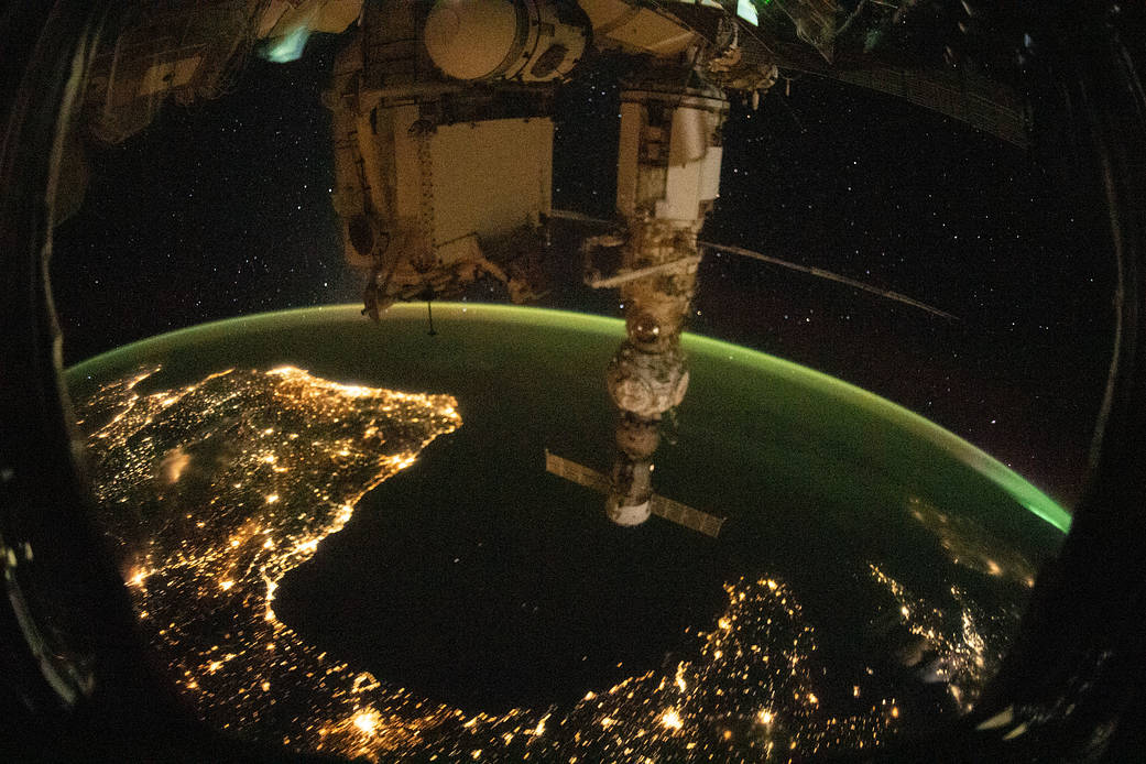 Night time photograph of European coastal city lights