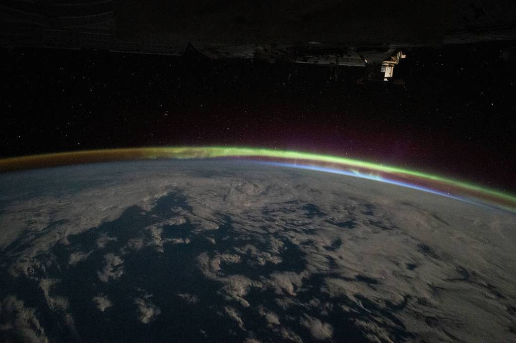 The aurora australis intersects Earth’s atmospheric glow