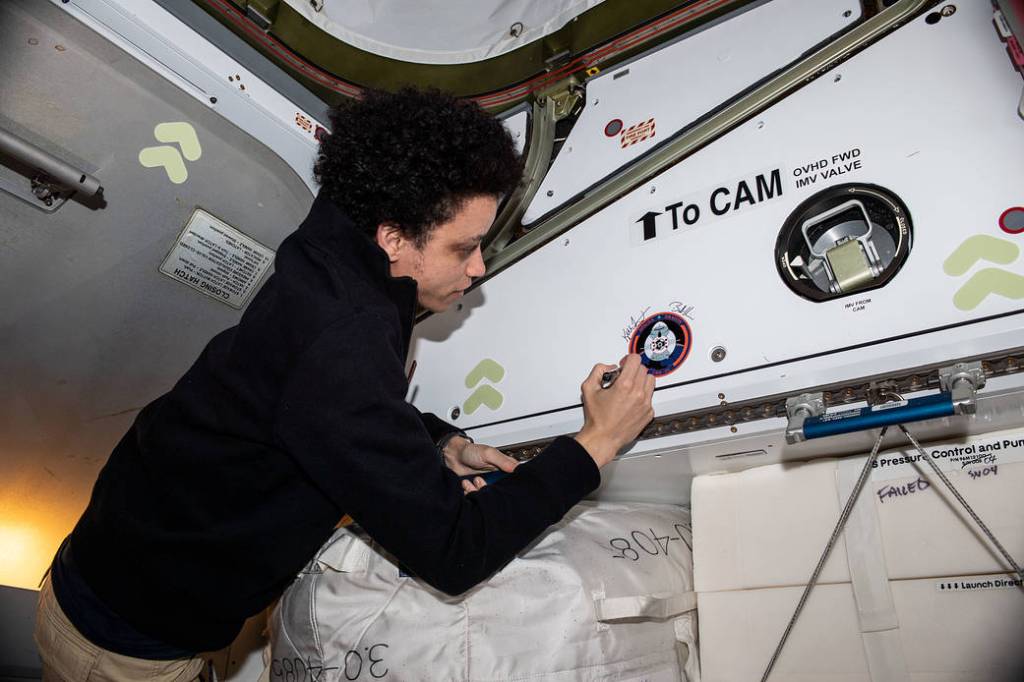 Astronaut Jessica Watkins signs her name on the Harmony module