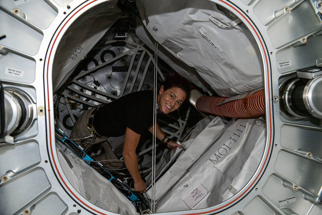 Astronaut Nicole Mann poses in front of BEAM