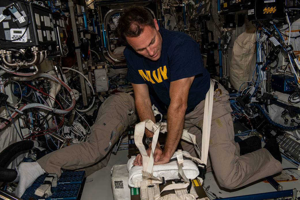Astronaut Josh Cassada practices CPR on the space station