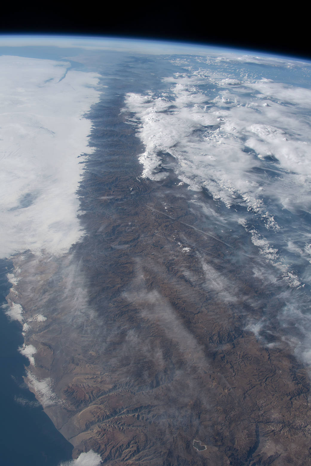 Clouds gather near the peaks of the Andes