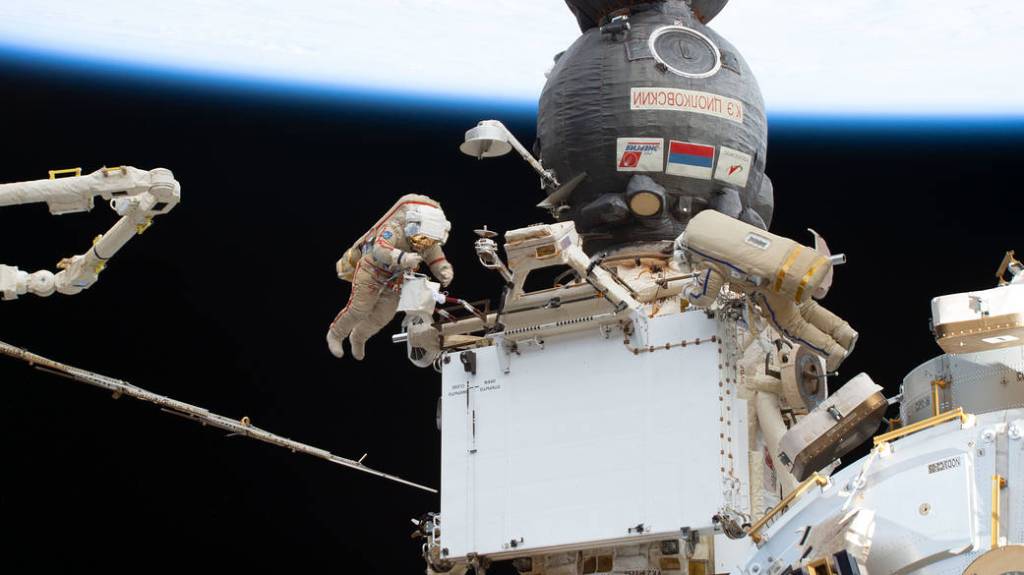 Cosmonauts Sergey Prokopyev and Dmitri Petelin during a spacewalk