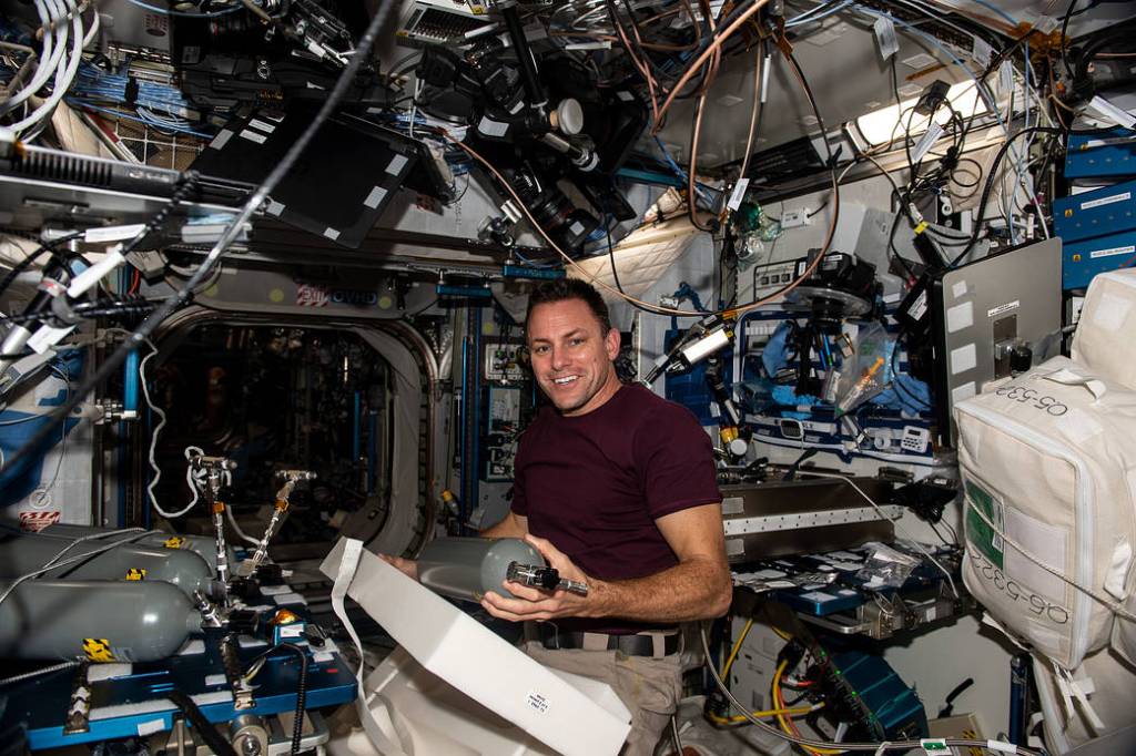 NASA astronaut Josh Cassada replaces carbon dioxide bottles
